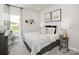 Neutral bedroom with decor art and patterned bed coverings at 148 Shepherds Landing Dr, Mooresville, NC 28115