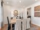 Dining room with natural wood table, linen chairs, and modern decor at 148 Shepherds Landing Dr, Mooresville, NC 28115