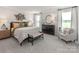 Beautiful main bedroom featuring large windows, neutral colors, and decorative wall art at 148 Shepherds Landing Dr, Mooresville, NC 28115