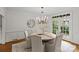Charming dining room featuring a stylish chandelier, and access to a backyard view at 1579 Queens W Rd, Charlotte, NC 28207