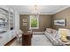 Cozy home office featuring custom built-ins, stylish decor, and an elegant chandelier at 1579 Queens W Rd, Charlotte, NC 28207