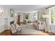 Bright and spacious living room featuring neutral decor, fireplace, and hardwood floors at 1579 Queens W Rd, Charlotte, NC 28207
