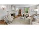 Charming living room with fireplace, hardwood floors, natural light, and cozy seating at 1579 Queens W Rd, Charlotte, NC 28207