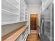 Spacious pantry featuring ample shelving, a butcher block countertop, and a stainless steel refrigerator at 1579 Queens W Rd, Charlotte, NC 28207
