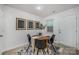 Bright dining area with a round table, four chairs, and modern black and white art at 1708 Holliford Ct, Charlotte, NC 28215