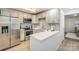 Updated kitchen featuring stainless steel appliances, white countertops, and subway tile backsplash at 1708 Holliford Ct, Charlotte, NC 28215