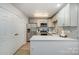 Well-lit kitchen featuring stainless steel appliances, white countertops, and subway tile backsplash at 1708 Holliford Ct, Charlotte, NC 28215