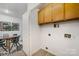 A look from the dining area into the utility room with built in cabinets at 1708 Holliford Ct, Charlotte, NC 28215