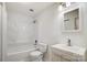 Modern bathroom featuring a shower-tub combo, toilet, and vanity with neutral-toned cabinet at 2514 Cranbrook Ln # 9, Charlotte, NC 28207