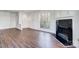 Bright living room with fresh paint, fireplace, and gleaming floors at 2514 Cranbrook Ln # 9, Charlotte, NC 28207