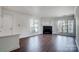 Bright living room boasts a fireplace, large windows, and gleaming floors at 2514 Cranbrook Ln # 9, Charlotte, NC 28207