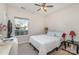 Secondary bedroom with ceiling fan and window at 4813 Chesney Nw St, Concord, NC 28027