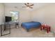 Spacious bedroom featuring a double bed and a red side table at 4813 Chesney Nw St, Concord, NC 28027