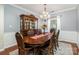 Formal dining room with a large wooden table and hutch at 4813 Chesney Nw St, Concord, NC 28027