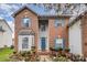 Brick home with blue shutters and a landscaped front yard at 4813 Chesney Nw St, Concord, NC 28027