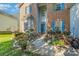 Two-story brick home with a blue door and landscaped walkway at 4813 Chesney Nw St, Concord, NC 28027