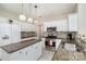 Modern kitchen with white cabinets and granite countertops at 4813 Chesney Nw St, Concord, NC 28027