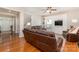 Living room with hardwood floors and brown leather furniture at 4813 Chesney Nw St, Concord, NC 28027