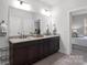 Double vanity bathroom with granite countertop and dark cabinets at 5003 Looking Glass Trl, Denver, NC 28037