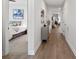 Hardwood floor hallway with access to bedrooms and living areas at 5003 Looking Glass Trl, Denver, NC 28037