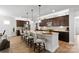 Modern kitchen features granite countertops and dark brown cabinetry at 5003 Looking Glass Trl, Denver, NC 28037