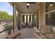 Relaxing screened porch with patio furniture and ceiling fan at 5003 Looking Glass Trl, Denver, NC 28037