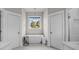Luxurious bathroom showcasing a freestanding tub, elegant fixtures, and natural light with stylish design elements at 511 E Main St, Rock Hill, SC 29730