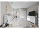 Bedroom featuring double windows, neutral walls, closet space, and a wall-mounted television at 511 E Main St, Rock Hill, SC 29730