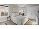 Bright bedroom features a double window, neutral walls, and closet space at 511 E Main St, Rock Hill, SC 29730