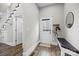 Welcoming entryway with hardwood floors, a charming bench, and convenient access to staircase and closet at 511 E Main St, Rock Hill, SC 29730