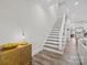 Hallway with hardwood floors, wooden cabinet and staircase leading to the upper level at 511 E Main St, Rock Hill, SC 29730