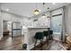 Modern kitchen with stainless steel appliances, breakfast bar with velvet stools, and a window providing natural light at 511 E Main St, Rock Hill, SC 29730
