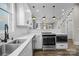 Charming kitchen with stainless appliances, granite counters, white cabinets, and seamless access to the dining area at 511 E Main St, Rock Hill, SC 29730