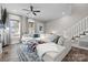 Sun-filled living room with a sectional sofa, fireplace, and staircase at 511 E Main St, Rock Hill, SC 29730