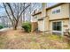 Backyard view of townhome with small patio and wooden fence at 6102 Heath Ridge Ct # G, Charlotte, NC 28210