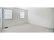 Bright bedroom with two windows and neutral walls at 6102 Heath Ridge Ct # G, Charlotte, NC 28210