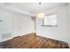 Bright dining area with hardwood floors and modern light fixture at 6102 Heath Ridge Ct # G, Charlotte, NC 28210