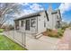 White brick building with gray accents, steps, and a ramp leading to the entrance at 6102 Heath Ridge Ct # G, Charlotte, NC 28210