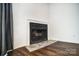 Modern corner fireplace with tiled hearth at 6102 Heath Ridge Ct # G, Charlotte, NC 28210