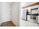 Modern kitchen with stainless steel appliances and white cabinets at 6102 Heath Ridge Ct # G, Charlotte, NC 28210