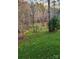 Landscaped backyard with a view of a peaceful river at 9267 Egret Rdg # 41, Belmont, NC 28012