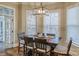 Bright breakfast nook with a table and chairs near French doors at 9267 Egret Rdg # 41, Belmont, NC 28012