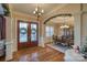 Elegant dining room features hardwood floors and a charming chandelier at 9267 Egret Rdg # 41, Belmont, NC 28012