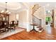 Elegant dining room with hardwood floors and a staircase at 9267 Egret Rdg # 41, Belmont, NC 28012