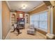 Cozy home office or exercise room with fireplace and built-in shelving at 9267 Egret Rdg # 41, Belmont, NC 28012