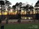 Captivating sunset view over the lake from a waterfront property at 9267 Egret Rdg # 41, Belmont, NC 28012