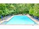 Inviting community swimming pool with ample lounge chairs at 9267 Egret Rdg # 41, Belmont, NC 28012