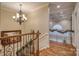 Elegant staircase with wrought iron railings leading to the upper level at 9267 Egret Rdg # 41, Belmont, NC 28012