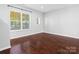 Bright living room with hardwood floors and large windows at 459 W Worthington Ave, Charlotte, NC 28203