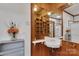 Bathroom with corner sink and wood-paneled walls at 102 Goodman Ne Cir, Concord, NC 28025